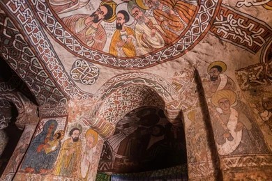Ancient colorful frescoes inside Abune Yemata church