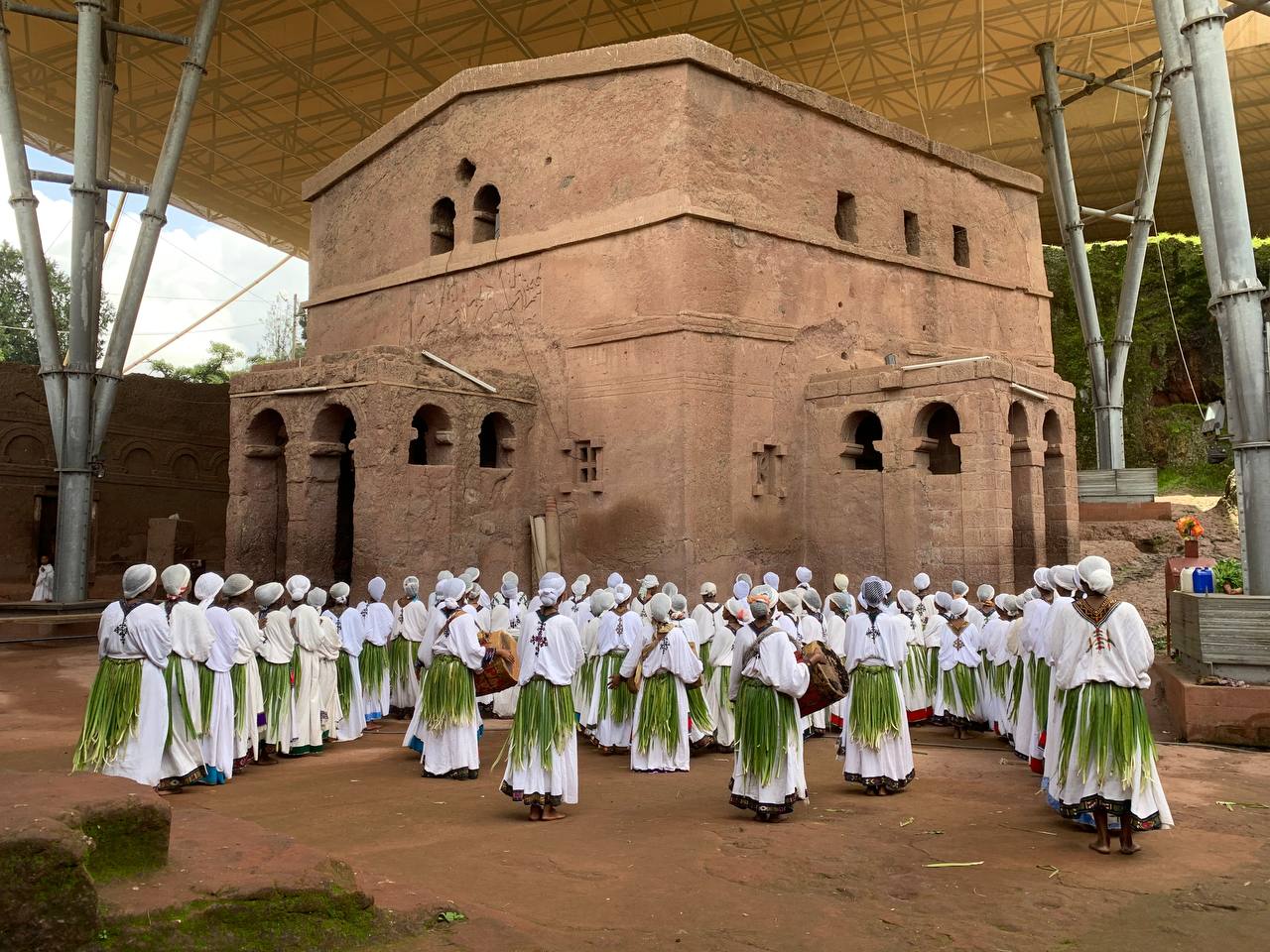 Young women in traditional attire dancing and singing during the Ashenda festival.
