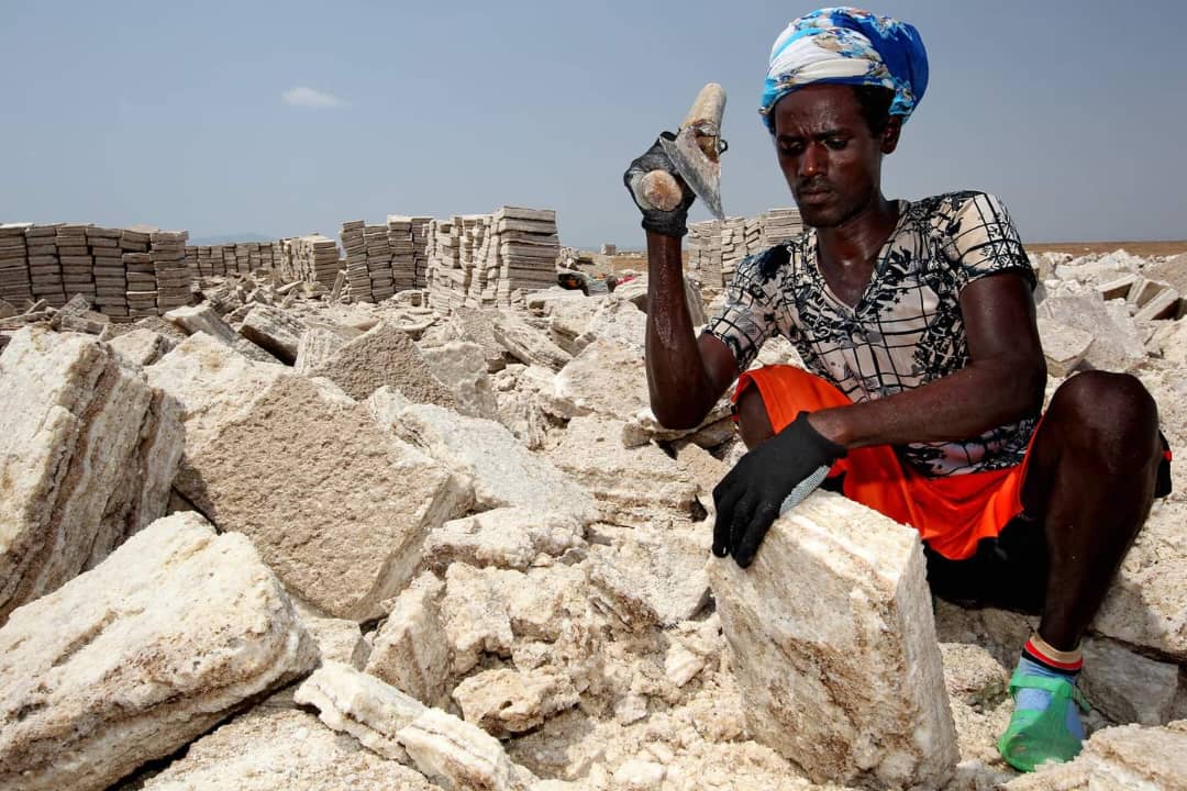 Afar man mining salt at Lake Assale